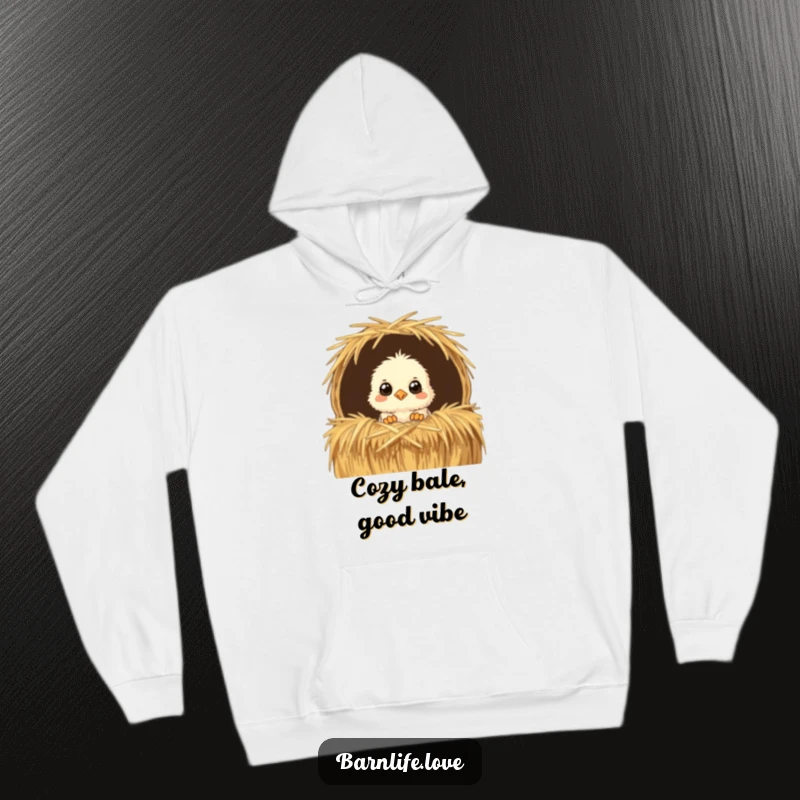 Funny Hoodie featuring a fluffy chick peeking with wide eyes from a straw bale, a cozy and humorous farm animal apparel choice.