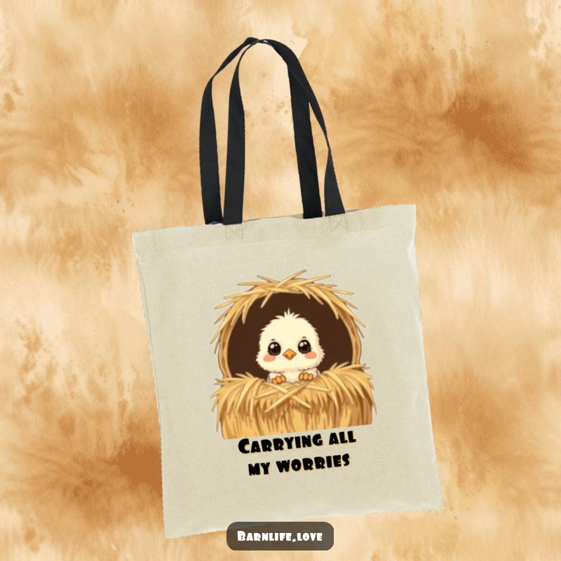 Funny Tote Bag depicting a fluffy chick with curious eyes peeking from a straw bale, a charming and practical farm-themed accessory.